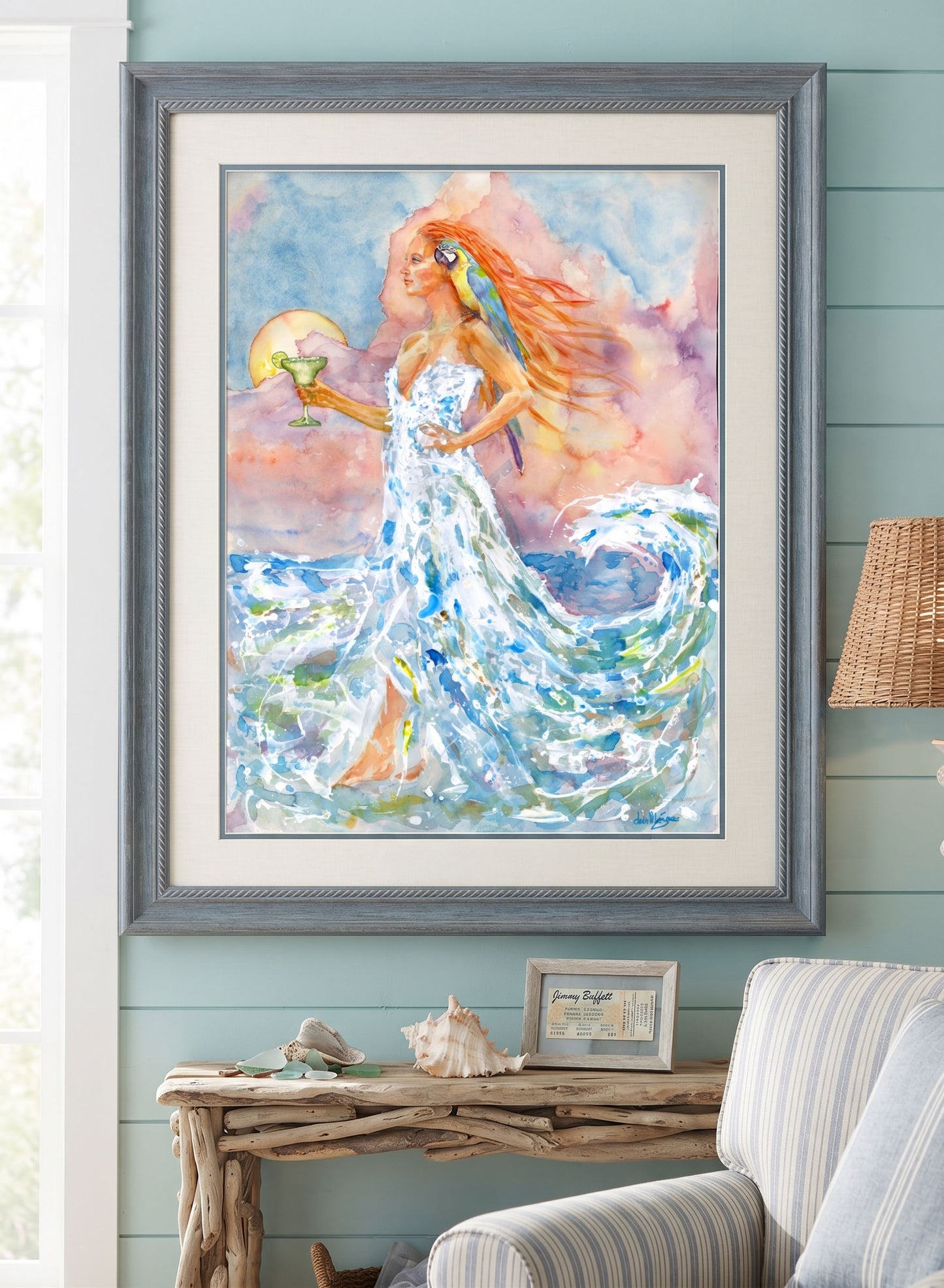 Watercolor painting titled "Treat Her Like A Lady" by David K. Jones, featuring a woman personifying the ocean wearing a gown made of foaming sea waves, holding a margarita with a parrot on her shoulder against a sunset sky.