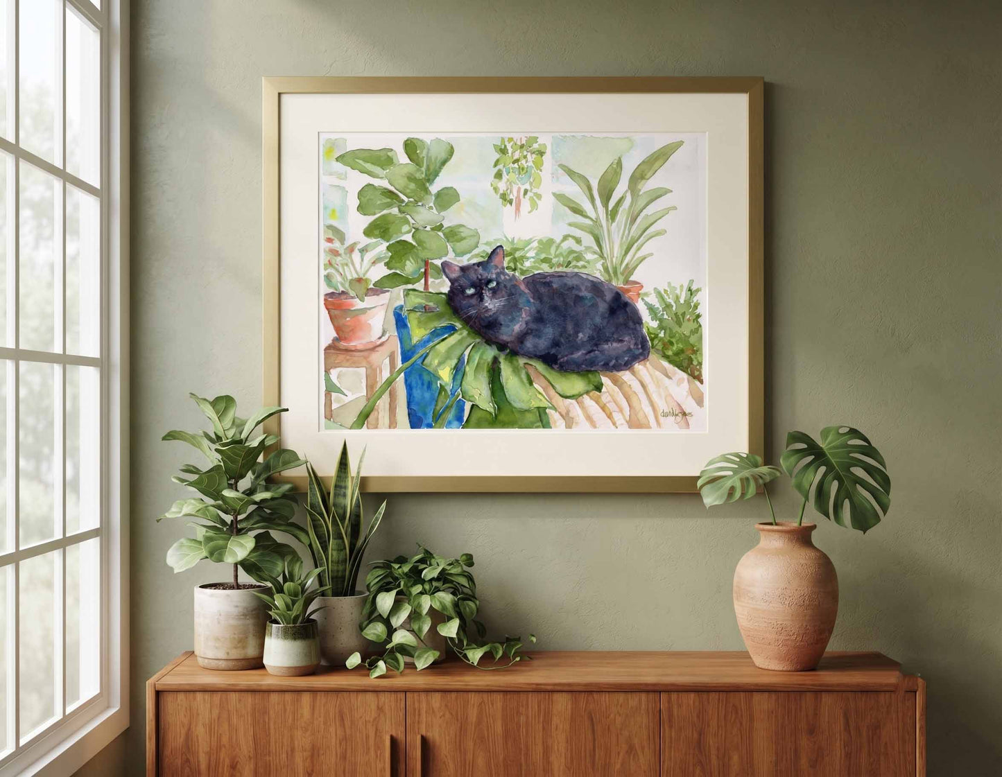 "Augustus" by David K. Jones - Original watercolor painting of a black cat resting on a large tropical plant leaf surrounded by vibrant indoor greenery.