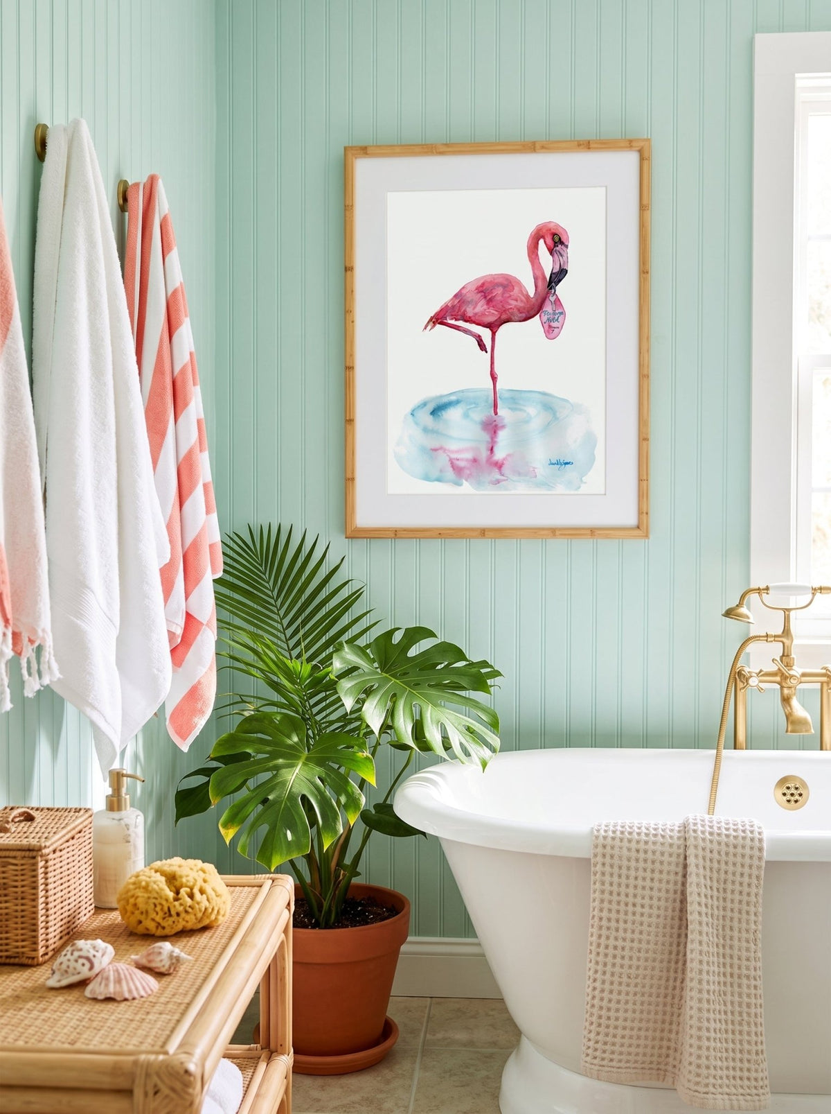 A watercolor painting titled "Flamingo Motel davidkjonesart.jpg", featuring a pink flamingo standing on one leg in a shallow pool of light blue water with its pink reflection visible below. The flamingo is holding a retro pink motel keychain in its beak with the text "Flamingo Motel Room 7". The artwork is signed by the artist in the bottom right corner.