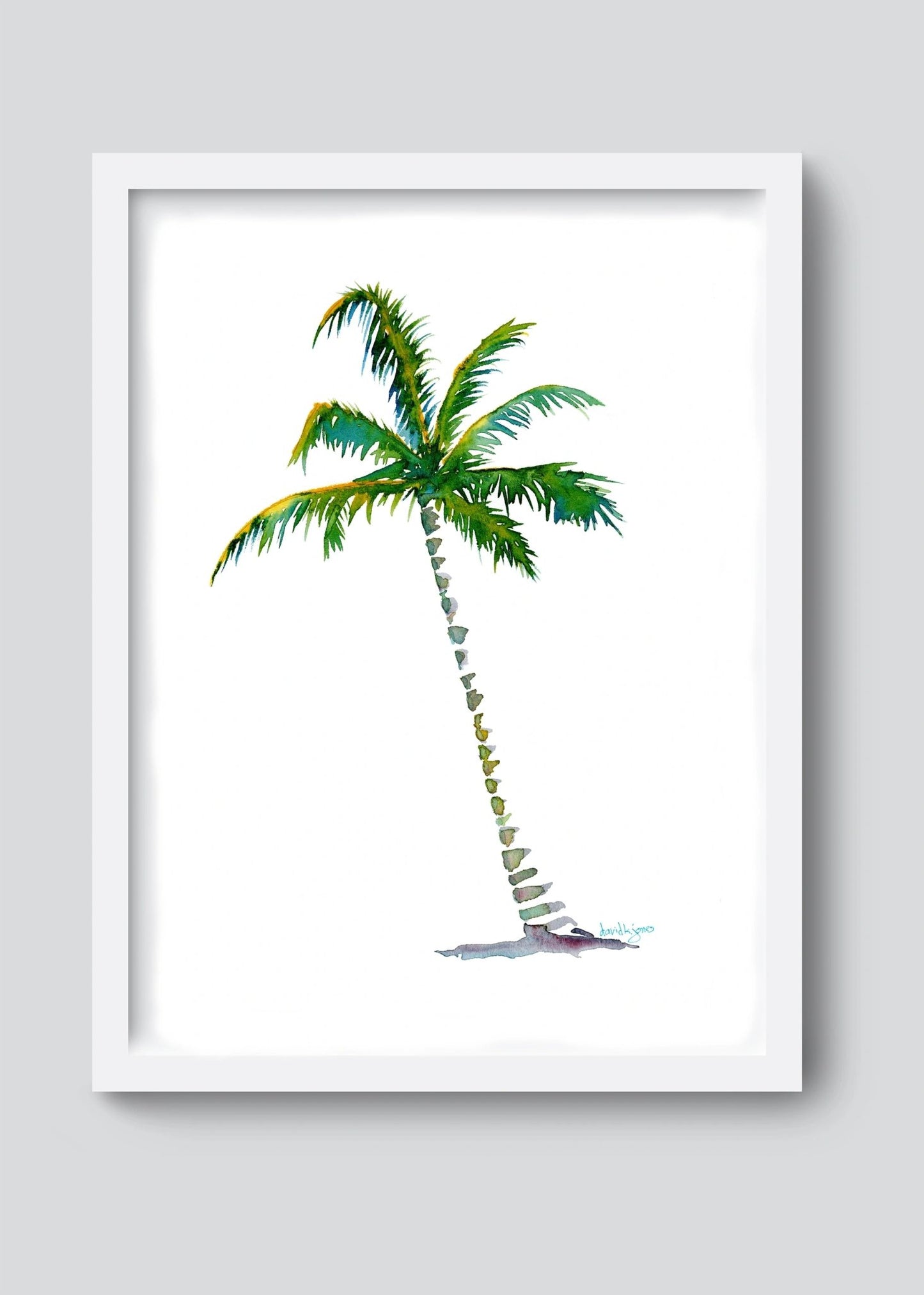 A framed vibrant watercolor painting of a single tropical palm tree against a clean white background by artist David K Jones. The palm features a slender, curved textured trunk and lush green fronds with subtle yellow and blue-green highlights, painted in a coastal, Key West style.