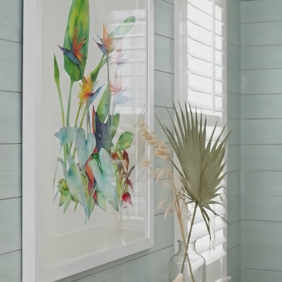 Video of watercolor painting on paper, "Tropical Kitty - Panther Wannabe" by David K. Jones. Features a black cat peering from a tropical garden of Bird of Paradise flowers and large green foliage. A detailed, playful fine art piece capturing the cat's expression.